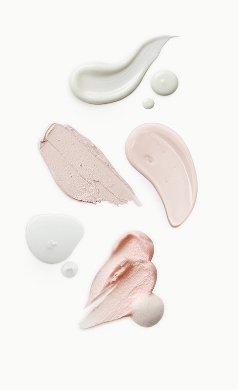 Swatches of white, pink and peach skincare textures